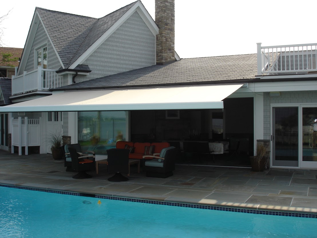 an extended awning over a swimming pool