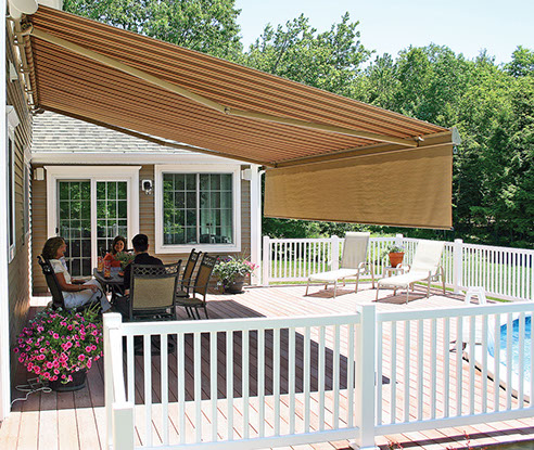 people dining under a Series G250 Retractable Awning