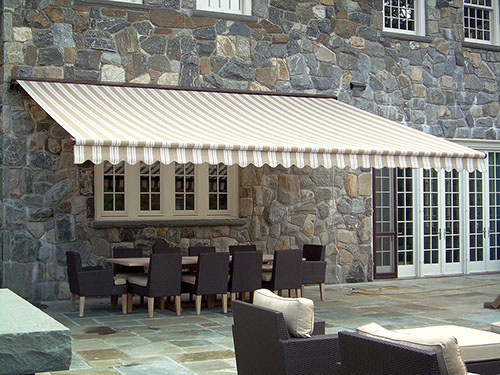 a Series 8700 Retractable Awning covering a table