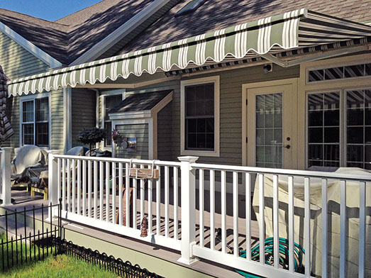 a Series 7700 Retractable Awning over a porch