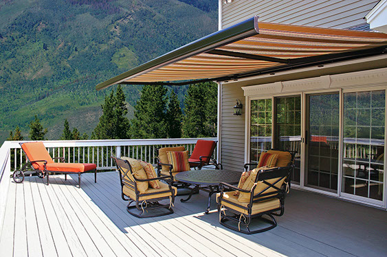 a backyard porch using a Series K300 Retractable Awning