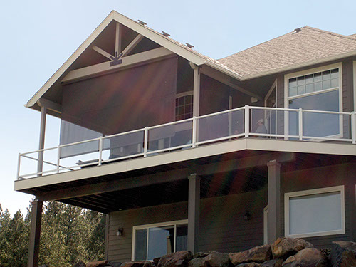 a second floor porch using drop shades